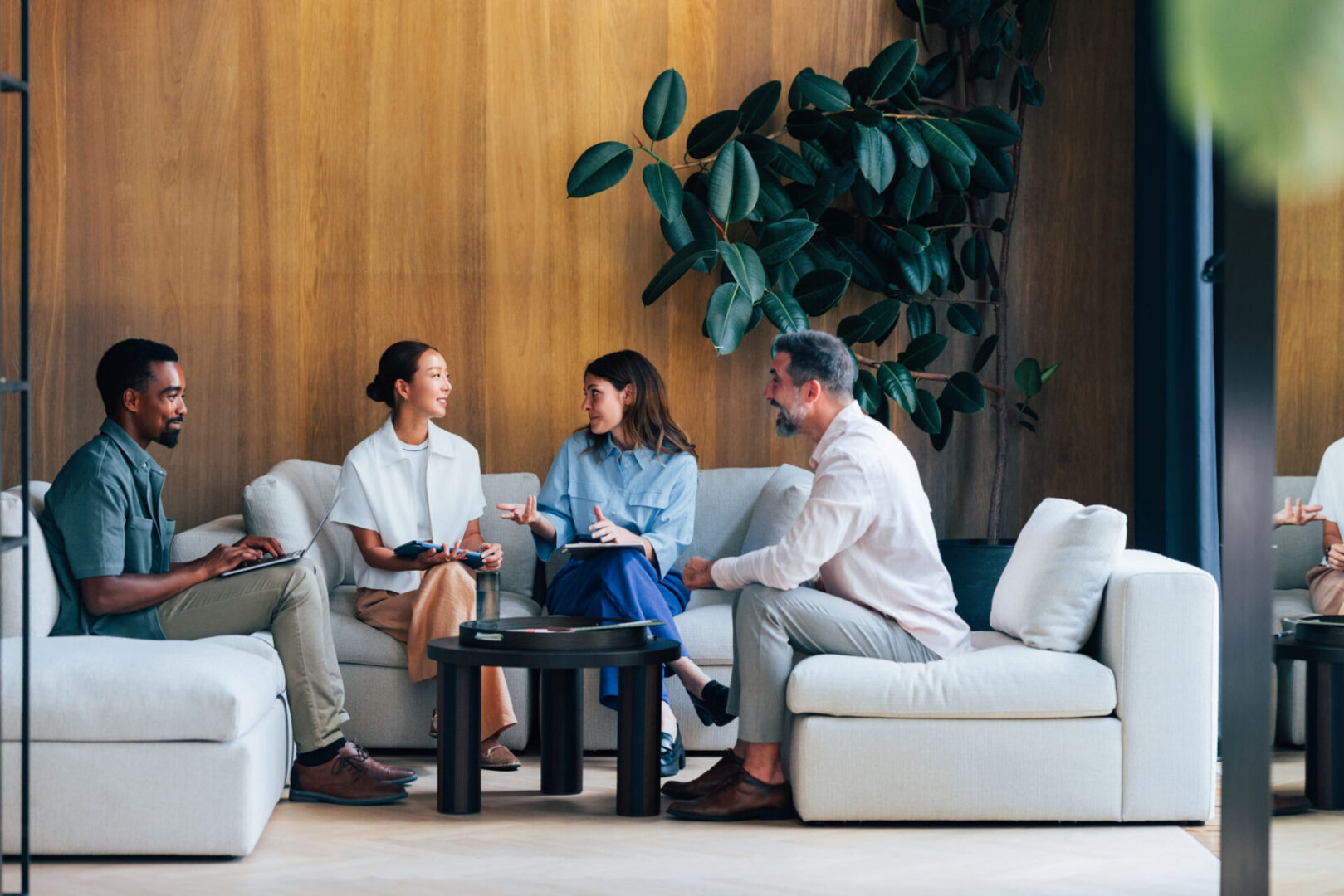 Team brainstorming session on comfortable sofas