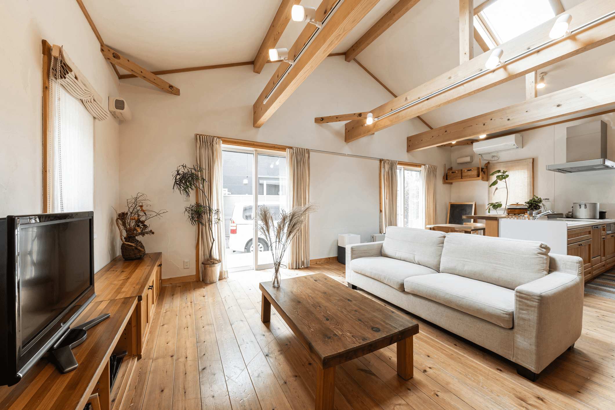Bright living room with exposed wooden beams