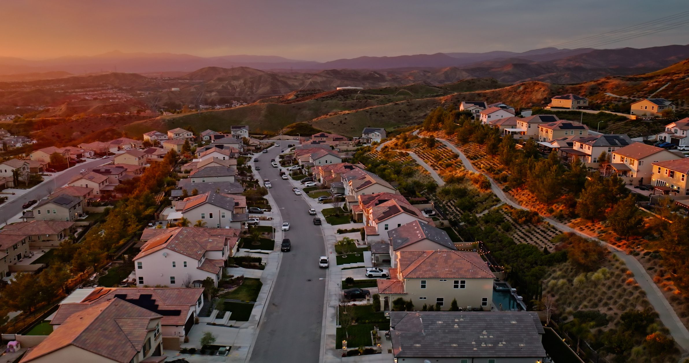 Aerial view of suburban homes at sunset
