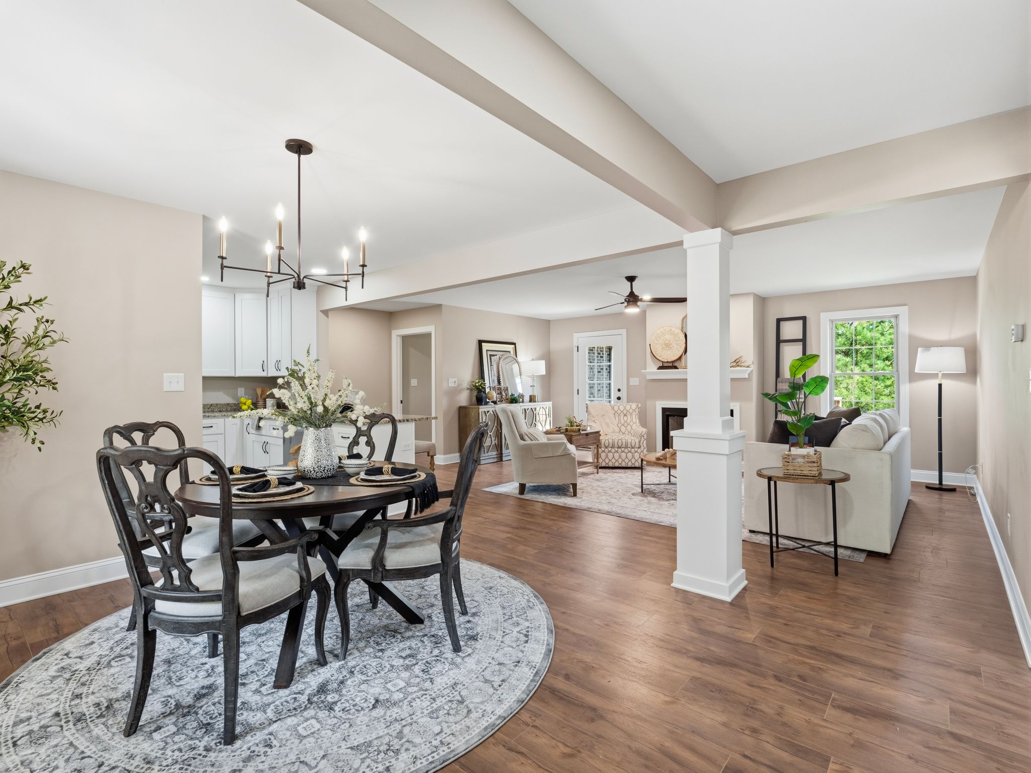 Bright open-concept living and dining room with elegant decor and natural light.