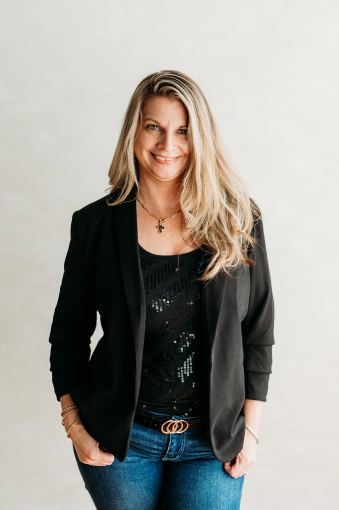 Portrait of Amanda Foley, Realtor, smiling in professional attire.