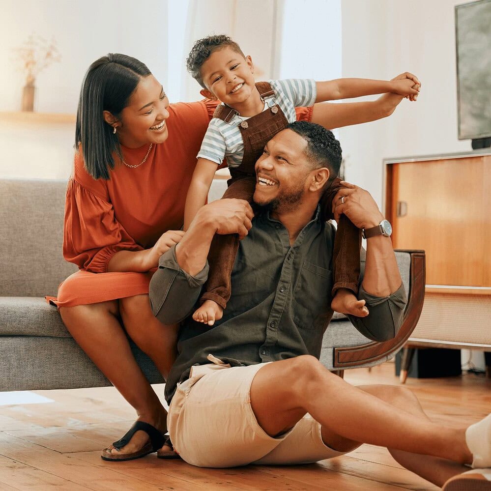 Parents with child having fun indoors